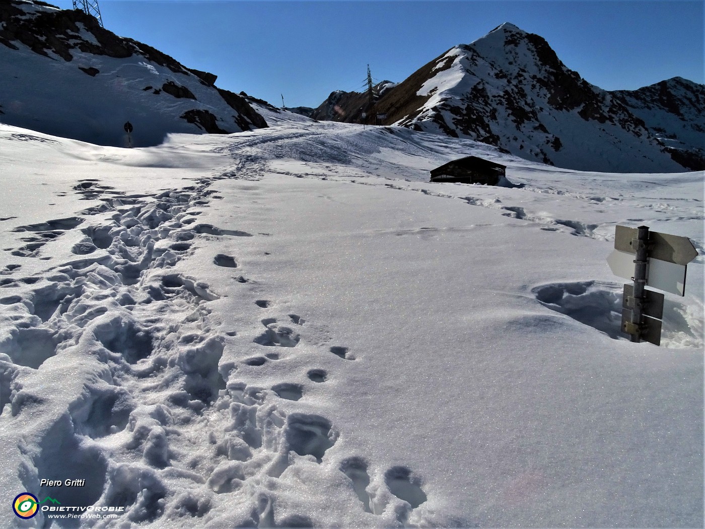 56 Rientro al Passo San Marco con affondi nella neve rammollita dal sole.JPG -                                